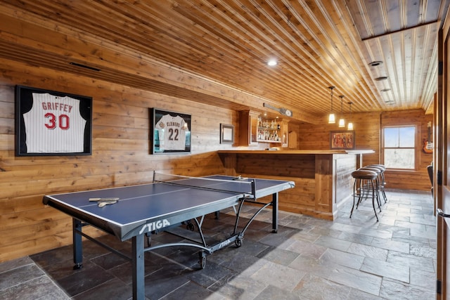 15193 Wilderness Trl, Crosslake, MN 56442 - recreation room with wooden ceiling, stone tile flooring, and wooden walls