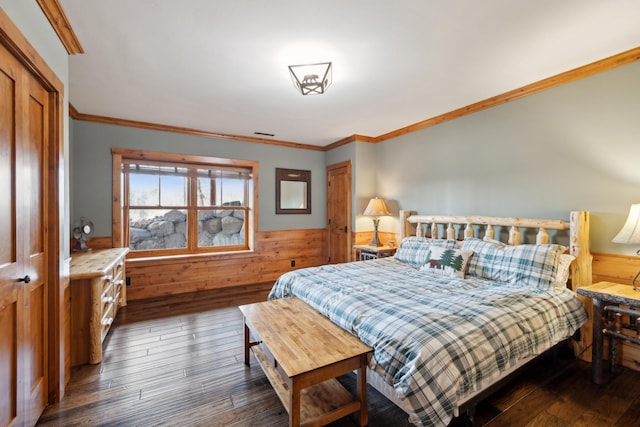 15193 Wilderness Trl, Crosslake, MN 56442 - bedroom featuring ornamental molding, wood-type flooring, wainscoting, wooden walls, and a closet