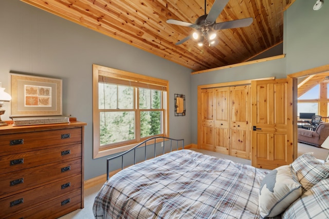 15193 Wilderness Trl, Crosslake, MN 56442 - bedroom with light colored carpet, multiple windows, vaulted ceiling, wood ceiling, and a closet