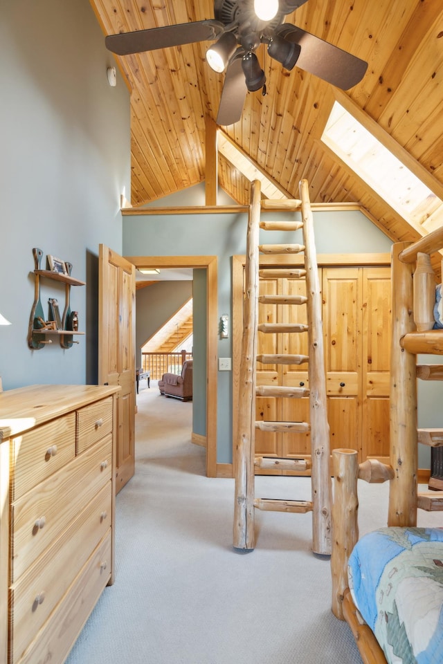 15193 Wilderness Trl, Crosslake, MN 56442 - bedroom featuring carpet floors, lofted ceiling, a skylight, and wooden ceiling