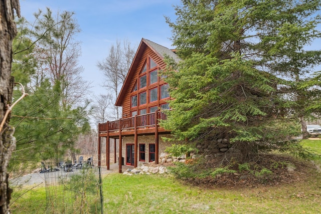 15193 Wilderness Trl, Crosslake, MN 56442 - rear view of property with a deck and a lawn