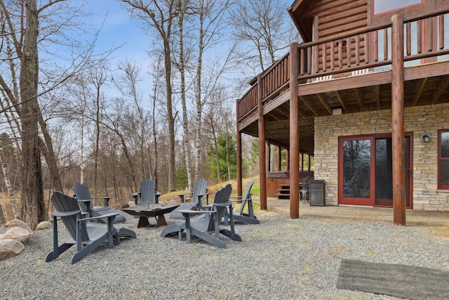 15193 Wilderness Trl, Crosslake, MN 56442 - view of patio / terrace with a hot tub, an outdoor fire pit, and a wooden deck
