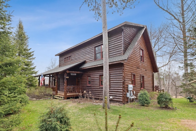 15193 Wilderness Trl, Crosslake, MN 56442 - back of house with a shingled roof, a yard, a deck, and log exterior