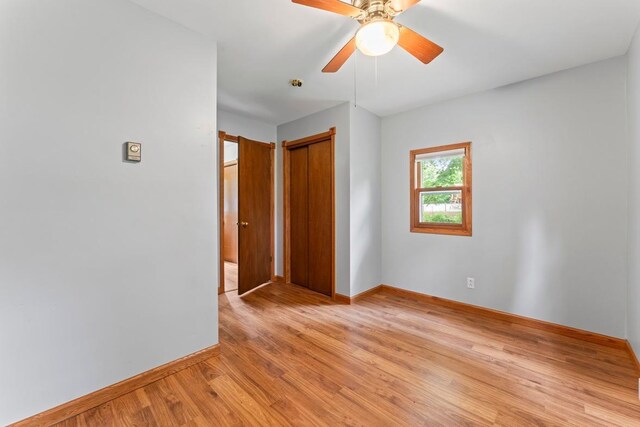 202 Cedar St, Pepin, WI 54759 - empty room with light wood finished floors and a ceiling fan
