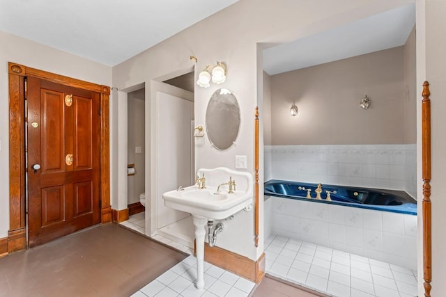 202 Cedar St, Pepin, WI 54759 - bathroom featuring a garden tub and tile patterned flooring