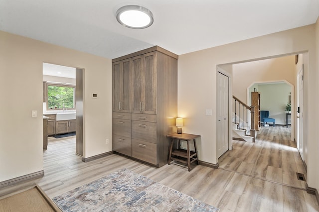 9950 204th Street Ct N, Forest Lake, MN 55025 - hallway with light wood finished floors and stairway