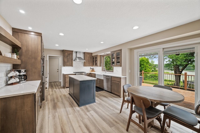 9950 204th Street Ct N, Forest Lake, MN 55025 - kitchen featuring dishwasher, open shelves, wall chimney exhaust hood, decorative backsplash, and a kitchen island