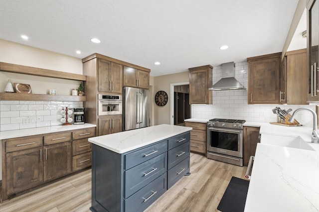9950 204th Street Ct N, Forest Lake, MN 55025 - kitchen featuring wall chimney range hood, stainless steel appliances, tasteful backsplash, open shelves, and light stone counters