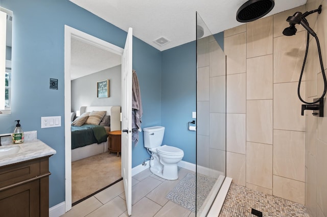 9950 204th Street Ct N, Forest Lake, MN 55025 - ensuite bathroom with vanity, tiled shower, and tile patterned flooring