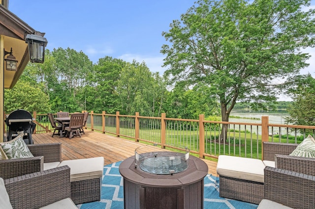 9950 204th Street Ct N, Forest Lake, MN 55025 - wooden deck with outdoor dining space, grilling area, an outdoor living space with a fire pit, and view of scattered trees