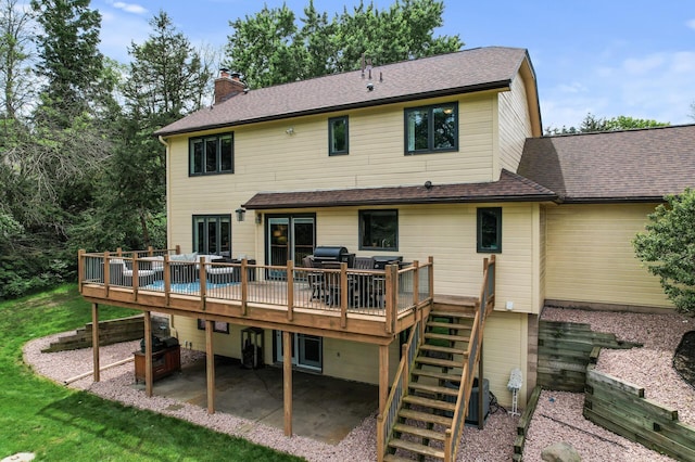 9950 204th Street Ct N, Forest Lake, MN 55025 - back of property with stairs, a patio, a deck, a chimney, and a shingled roof