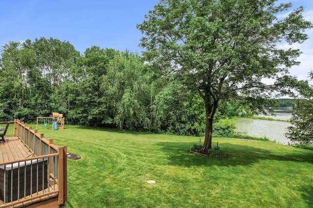 9950 204th Street Ct N, Forest Lake, MN 55025 - view of green lawn featuring a playground and a wooden deck