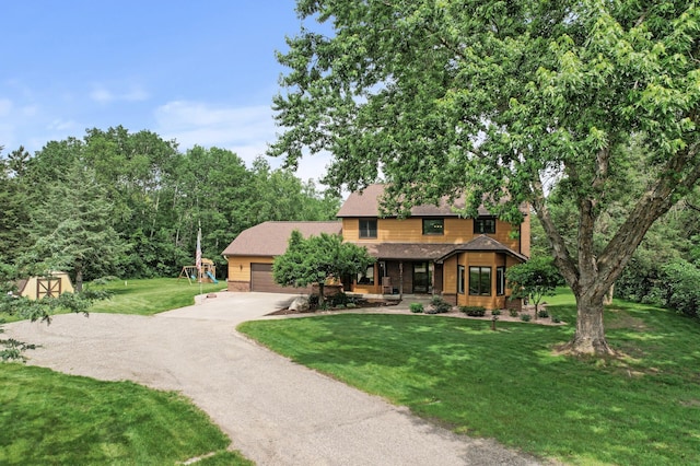 9950 204th Street Ct N, Forest Lake, MN 55025 - view of front of property with driveway, an attached garage, a front lawn, a playground, and a porch