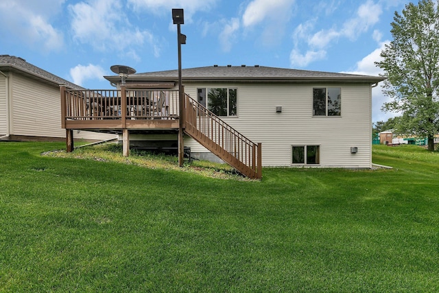 1664 Payton Ct NE, Sauk Rapids, MN 56379 - back of property featuring a lawn, a wooden deck, and stairs