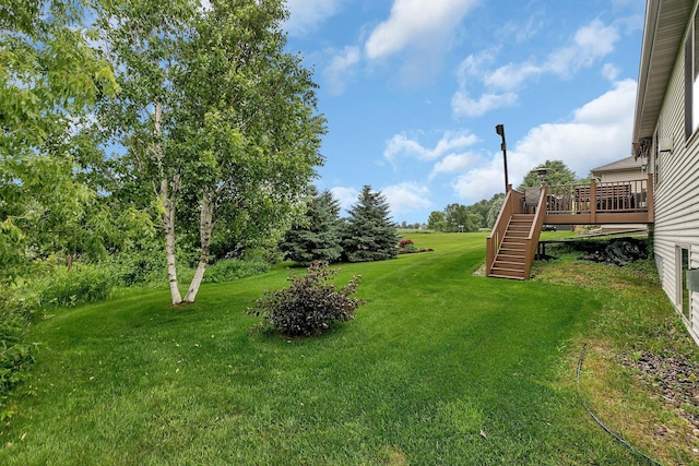 1664 Payton Ct NE, Sauk Rapids, MN 56379 - view of green lawn with stairs and a deck