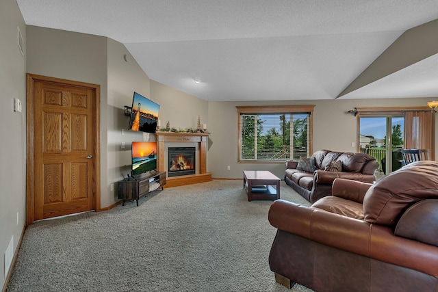 1664 Payton Ct NE, Sauk Rapids, MN 56379 - living area with vaulted ceiling, carpet flooring, and a glass covered fireplace