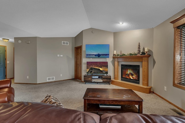 1664 Payton Ct NE, Sauk Rapids, MN 56379 - carpeted living room with a glass covered fireplace and lofted ceiling