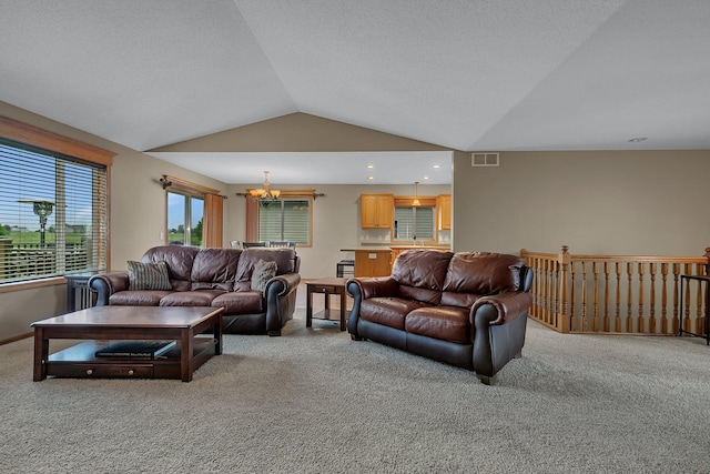 1664 Payton Ct NE, Sauk Rapids, MN 56379 - living area featuring light colored carpet, lofted ceiling, and a chandelier