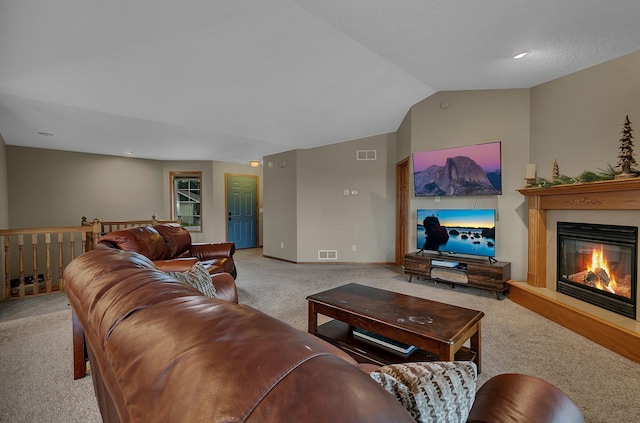 1664 Payton Ct NE, Sauk Rapids, MN 56379 - living room featuring carpet flooring, lofted ceiling, and a glass covered fireplace