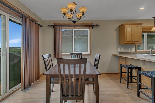 1664 Payton Ct NE, Sauk Rapids, MN 56379 - dining room with a chandelier, light wood finished floors, and recessed lighting
