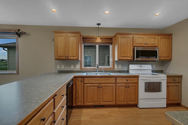 1664 Payton Ct NE, Sauk Rapids, MN 56379 - kitchen featuring stainless steel microwave, white electric range oven, light wood-style floors, black dishwasher, and recessed lighting