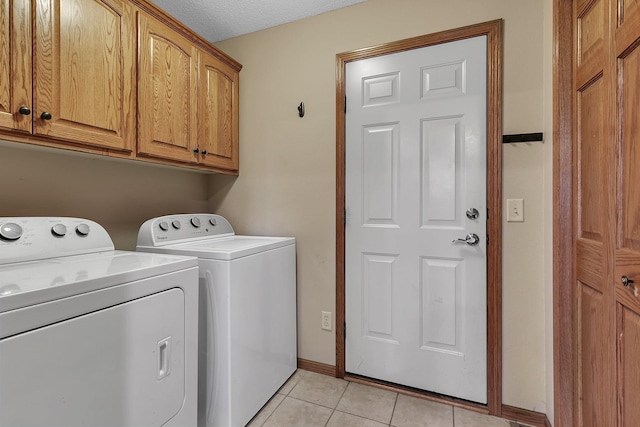 1664 Payton Ct NE, Sauk Rapids, MN 56379 - laundry area with washer and clothes dryer, cabinet space, and light tile patterned floors