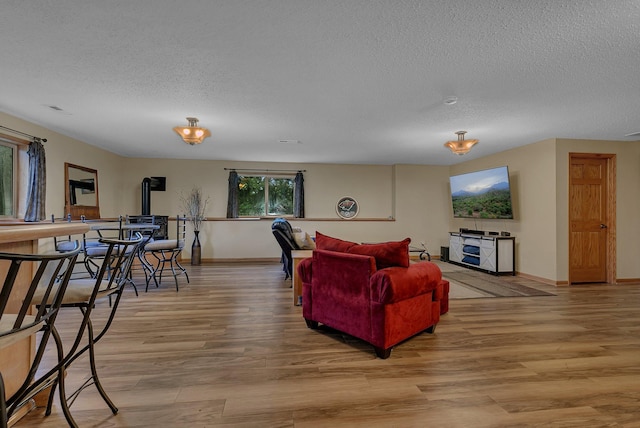 1664 Payton Ct NE, Sauk Rapids, MN 56379 - living room with a textured ceiling and light wood finished floors