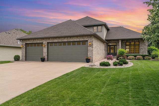 517 Redpoll Ave SE, New Prague, MN 56071 - french provincial home featuring an attached garage, brick siding, concrete driveway, and a front lawn