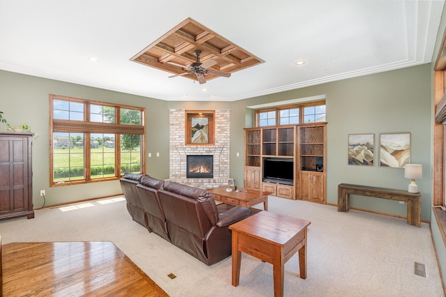 517 Redpoll Ave SE, New Prague, MN 56071 - living area with ceiling fan, a fireplace, ornamental molding, recessed lighting, and light wood-style floors