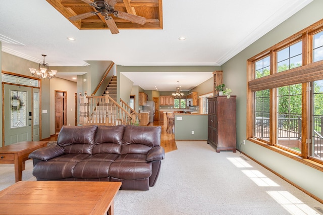 517 Redpoll Ave SE, New Prague, MN 56071 - living area with a chandelier, stairway, light colored carpet, crown molding, and ceiling fan