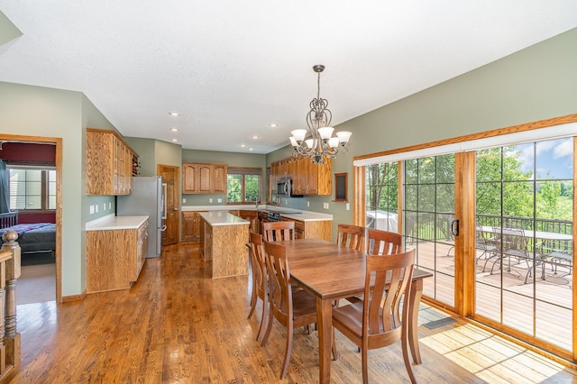 517 Redpoll Ave SE, New Prague, MN 56071 - dining area with a chandelier, light wood-style flooring, and recessed lighting
