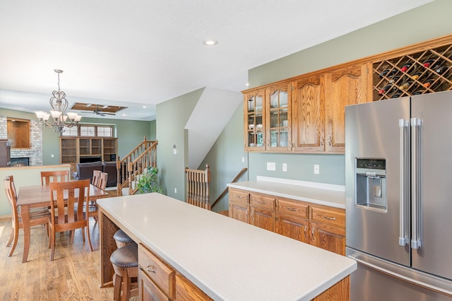 517 Redpoll Ave SE, New Prague, MN 56071 - kitchen with high quality fridge, recessed lighting, light countertops, a chandelier, and light wood-style flooring