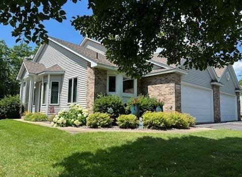12440 Eagle Cir NW, Coon Rapids, MN 55448 - ranch-style home with a garage, a front lawn, and asphalt driveway