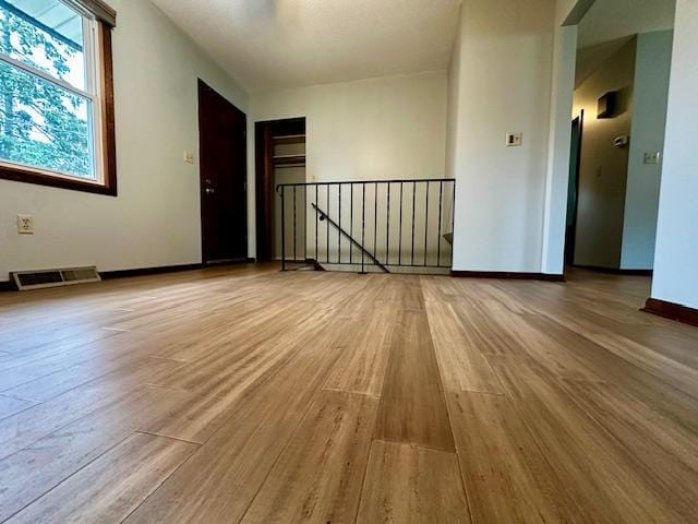 2671 4th Ave NE, Rochester, MN 55906 - empty room featuring wood finished floors and baseboards