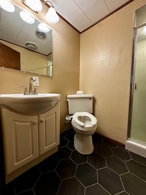 2671 4th Ave NE, Rochester, MN 55906 - bathroom with a stall shower, ornamental molding, vanity, and tile patterned flooring