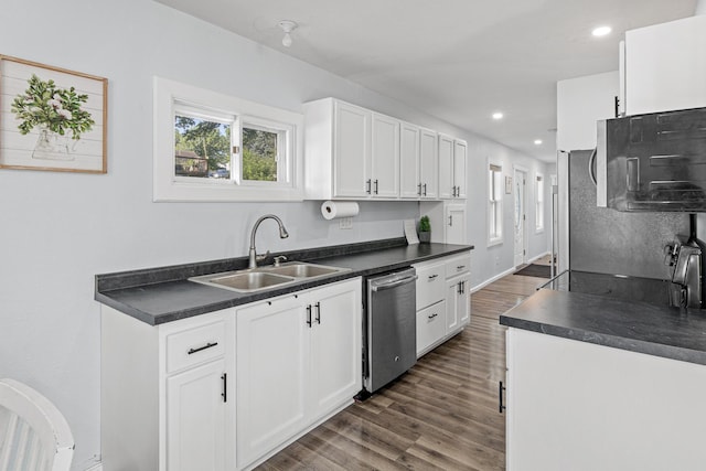 706 2nd Ave NW, New Brighton, MN 55112 - kitchen with dishwasher, dark countertops, dark wood finished floors, and recessed lighting
