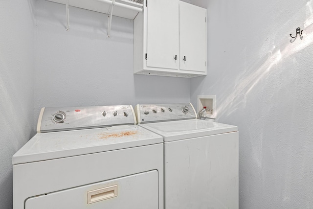 706 2nd Ave NW, New Brighton, MN 55112 - laundry room with cabinet space and washer and clothes dryer