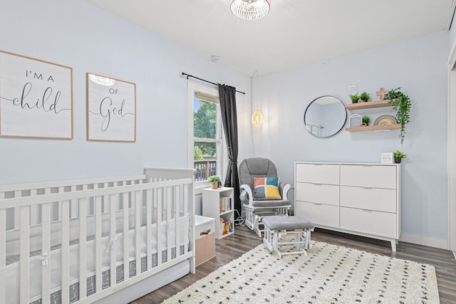 706 2nd Ave NW, New Brighton, MN 55112 - bedroom featuring wood finished floors and a crib