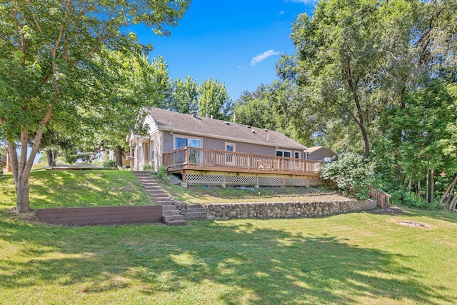 706 2nd Ave NW, New Brighton, MN 55112 - back of property with a wooden deck, a lawn, and stairway