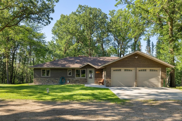 11100 Fisher Ln, Park Rapids, MN 56470 - view of front of house featuring stone siding, concrete driveway, an attached garage, and a front yard