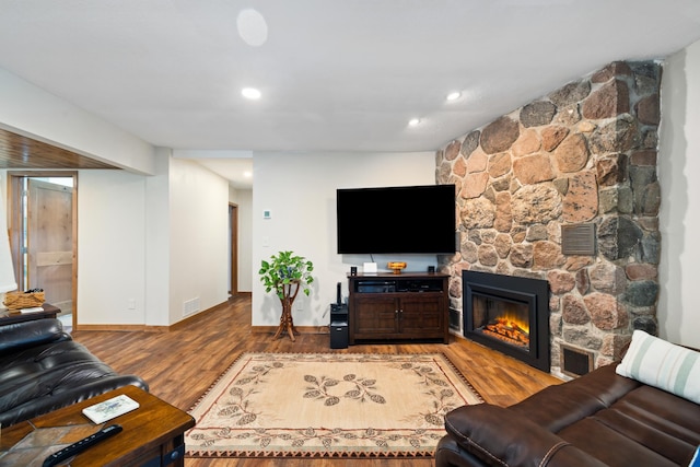 11100 Fisher Ln, Park Rapids, MN 56470 - living room featuring wood finished floors, recessed lighting, and a stone fireplace