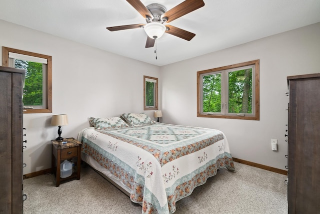 11100 Fisher Ln, Park Rapids, MN 56470 - bedroom with multiple windows, carpet, and a ceiling fan