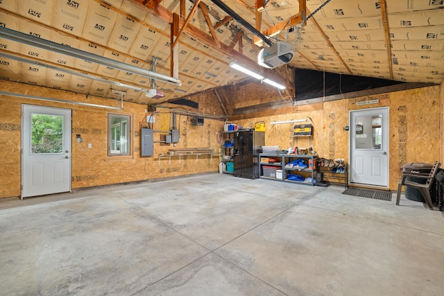 11100 Fisher Ln, Park Rapids, MN 56470 - garage featuring a garage door opener and electric panel