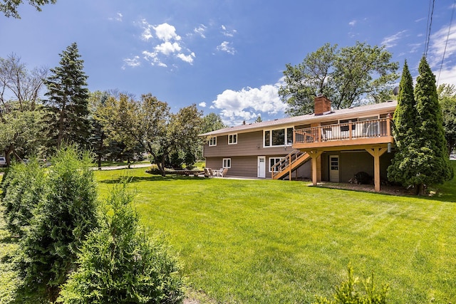 6721 Limerick Ln, Edina, MN 55439 - rear view of house with stairway, a wooden deck, a chimney, and a lawn