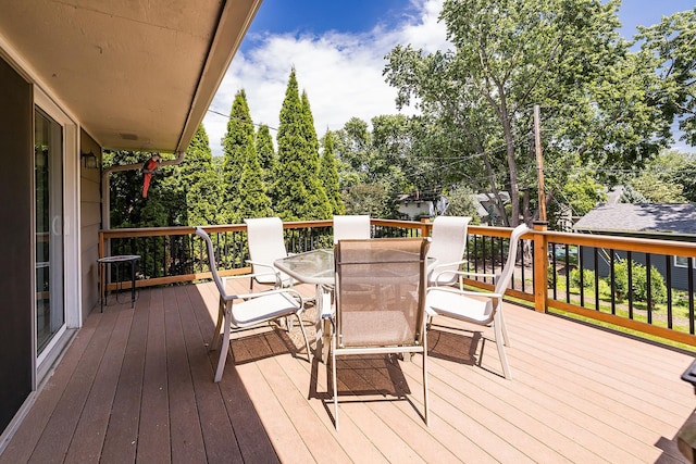6721 Limerick Ln, Edina, MN 55439 - wooden deck with outdoor dining space and view of scattered trees