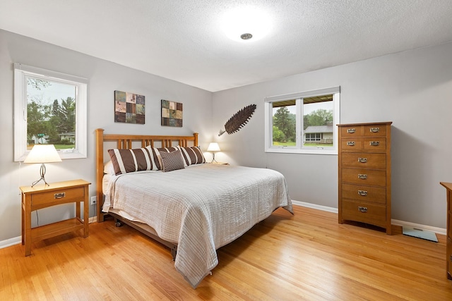 6721 Limerick Ln, Edina, MN 55439 - bedroom with light wood-type flooring and multiple windows