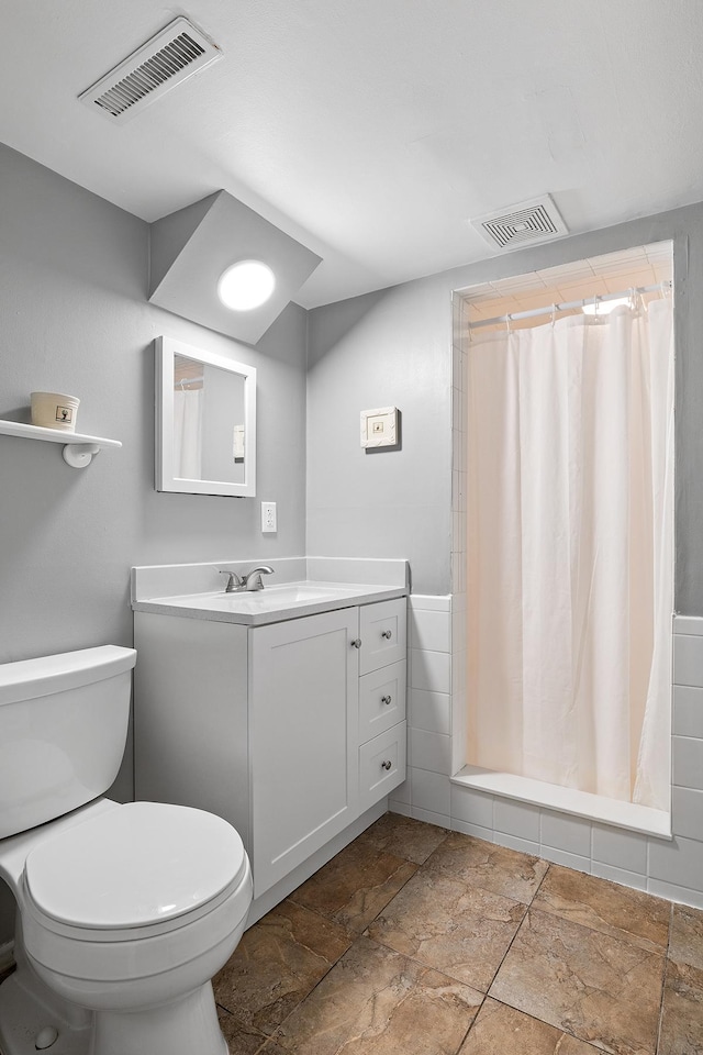 6721 Limerick Ln, Edina, MN 55439 - bathroom featuring vanity, a shower with curtain, and stone finish floors