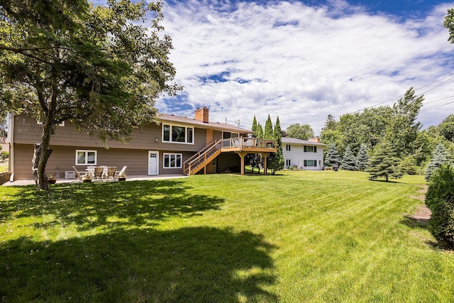 6721 Limerick Ln, Edina, MN 55439 - back of house featuring stairs, a chimney, a deck, a yard, and a patio