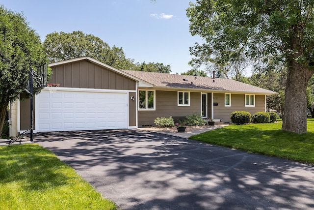 6721 Limerick Ln, Edina, MN 55439 - ranch-style house with asphalt driveway, a front lawn, an attached garage, and roof with shingles