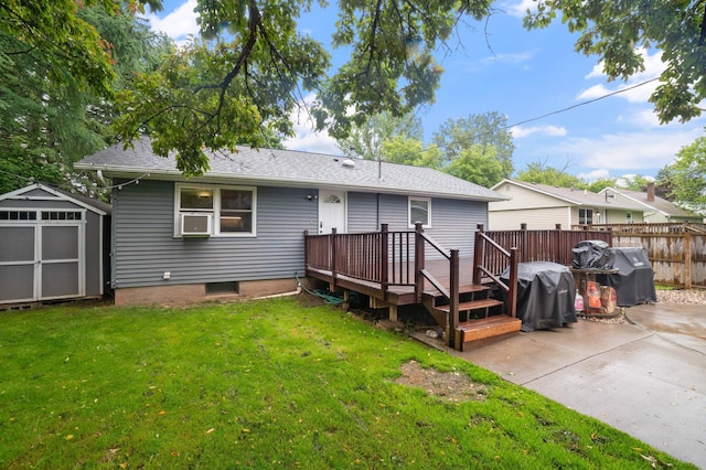 311 70th Ave W, Duluth, MN 55807 - back of property with a patio area, a shed, a wooden deck, roof with shingles, and cooling unit